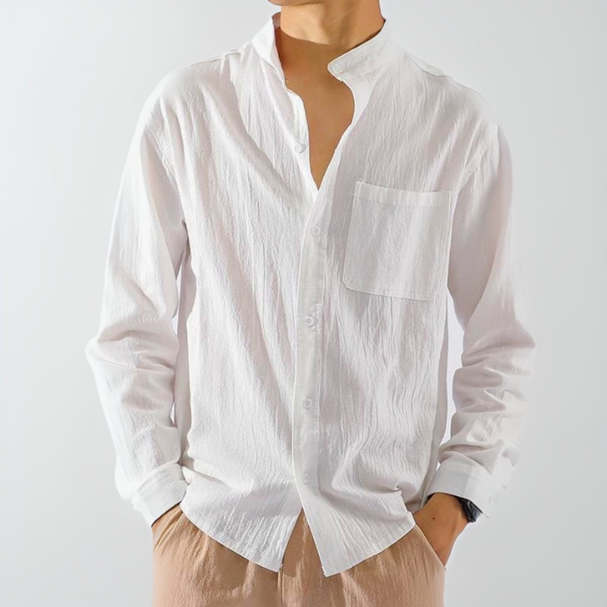 White crinkled cotton grandad-collar shirt with chest pocket, buttoned loosely