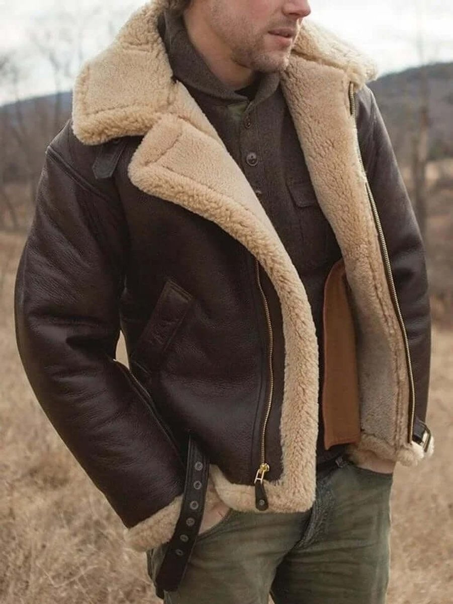 Side view of brown shearling aviator jacket with buckled strap and fur cuffs