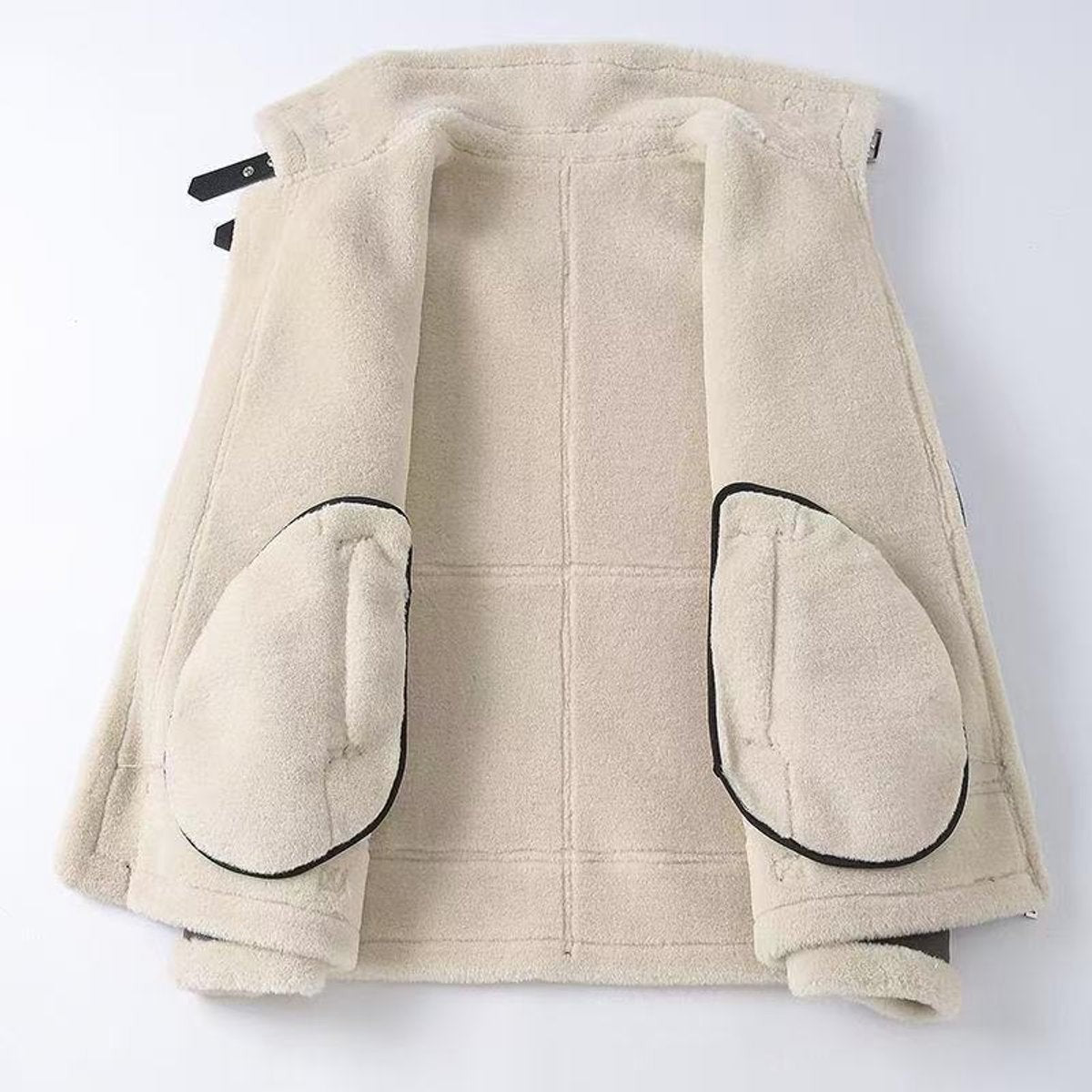 Cream shearling lining and fleece pockets inside a men's aviator bomber jacket