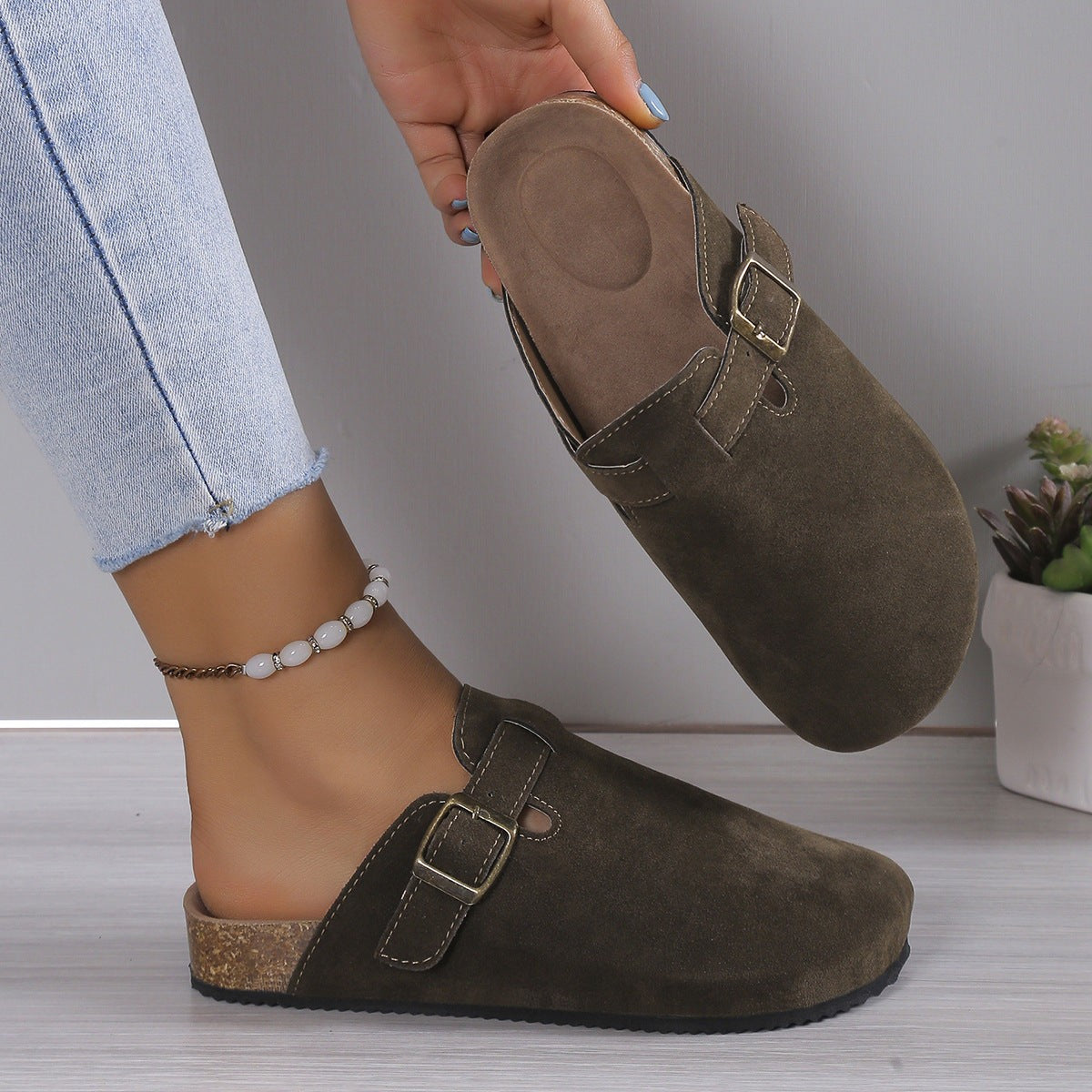 Olive suede footbed clog sandal shown from the sole