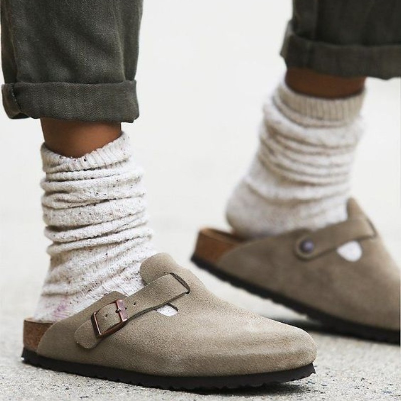 Taupe suede buckle clogs worn with knitted ankle socks