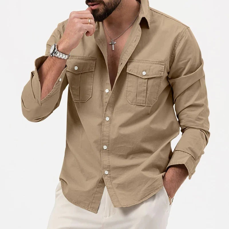 Khaki utility shirt worn casually with sleeve rolled and hand in pocket
