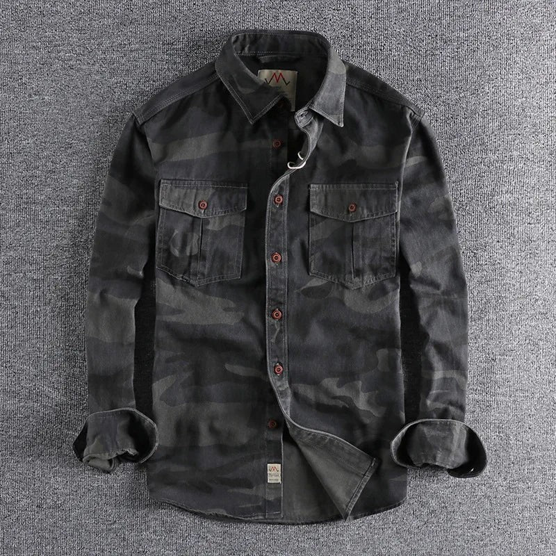 Grey camouflage shirt with red-buttoned chest pockets and rolled cuffs
