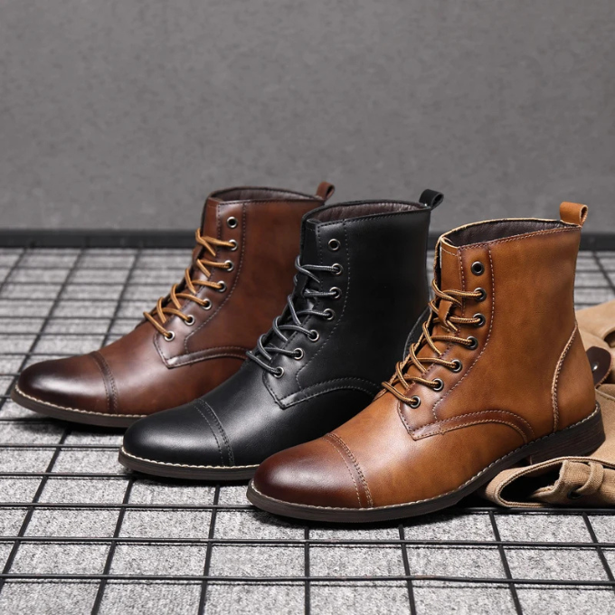 Black, dark brown and tan leather boots lined up together, side by side