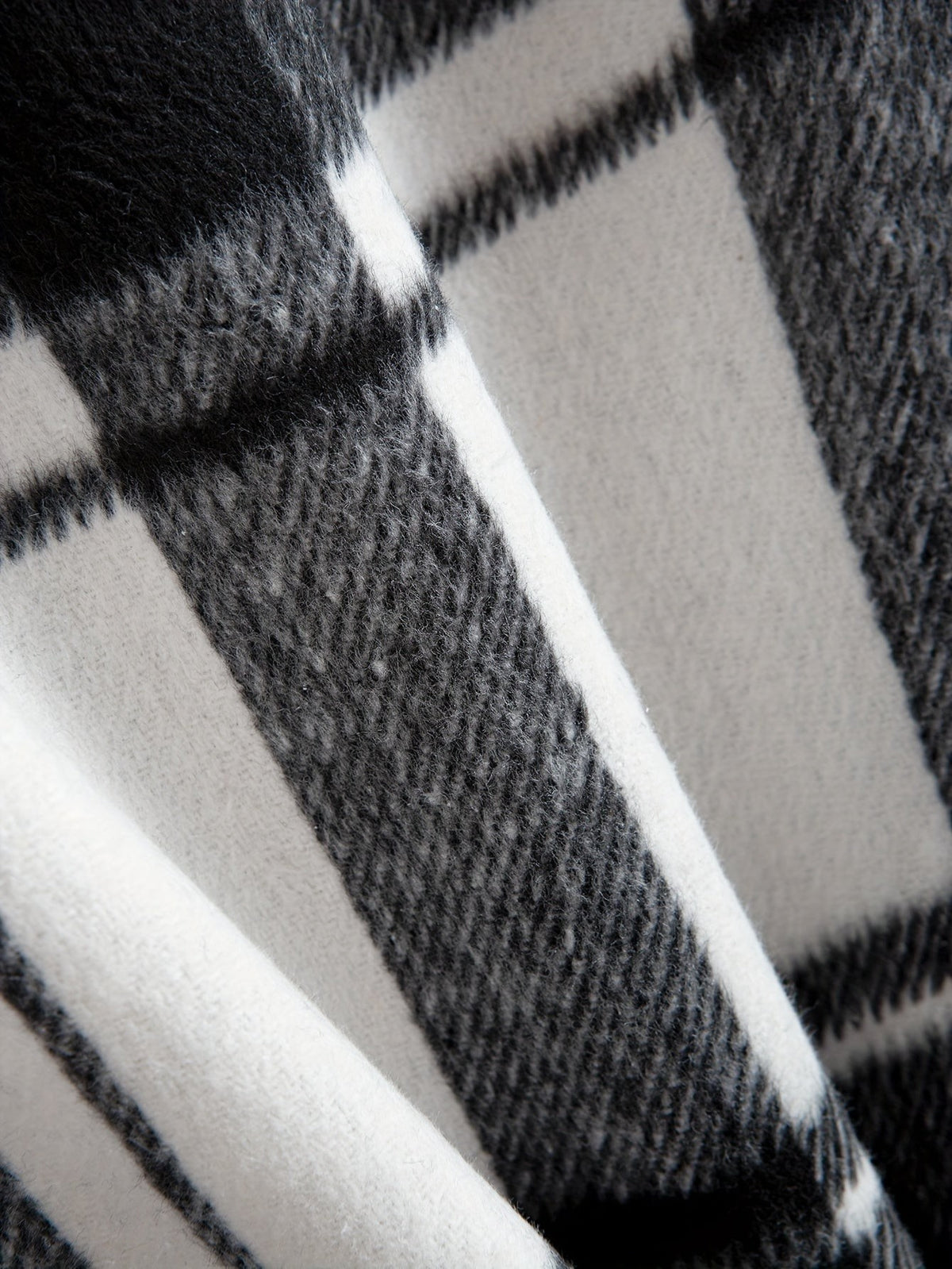 Close-up texture of black and white plaid flannel fabric