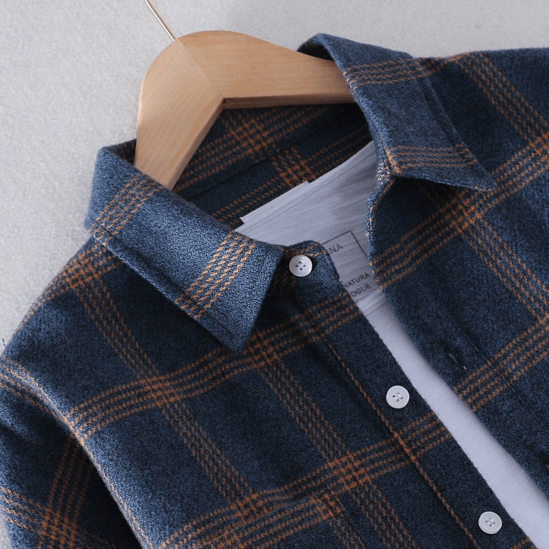 Close-up of navy check flannel shirt collar and button placket detail