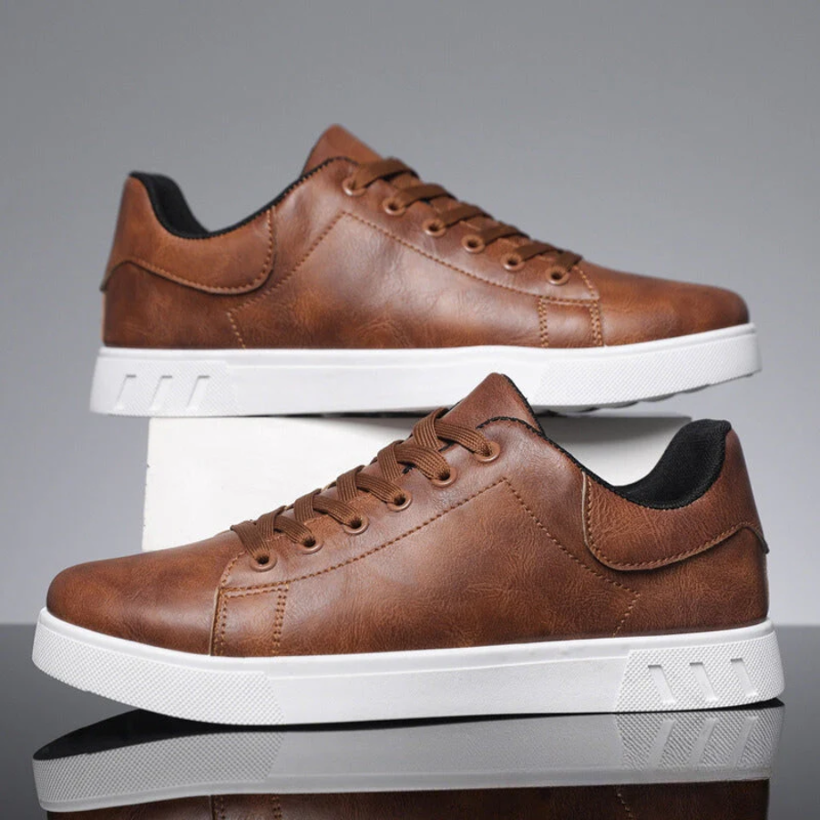 Pair of brown leather trainers stacked with white ridged soles