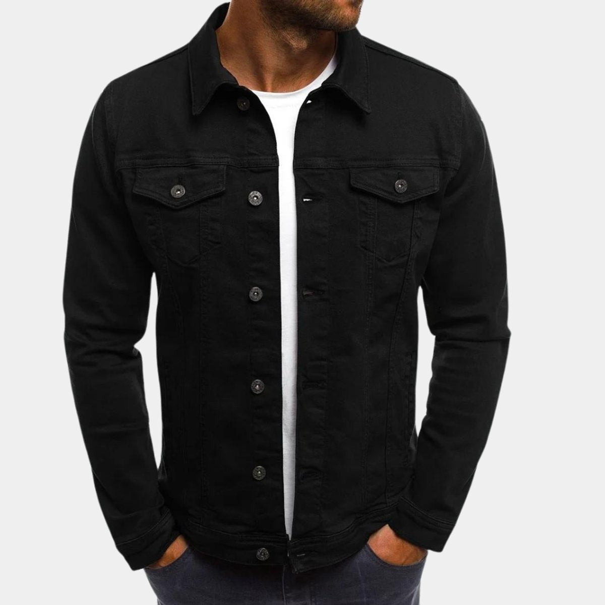 Black denim jacket with button-up front and chest flap pockets, worn open
