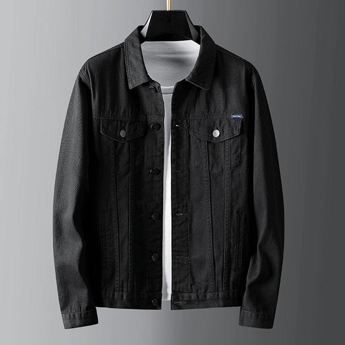 Black button-front denim jacket with twin chest pockets and classic collar