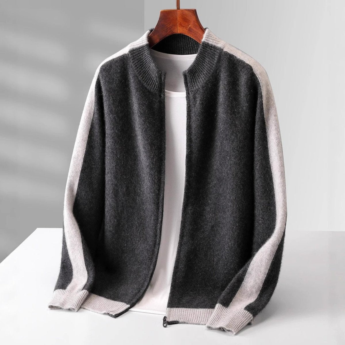 Charcoal grey zip cardigan with cream contrast sleeve panel and ribbed collar