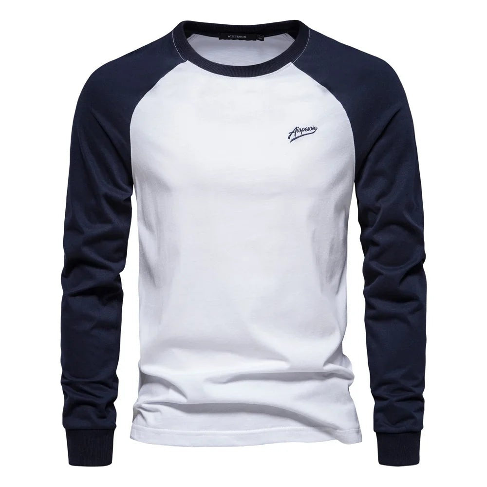 White raglan long sleeve shirt with navy contrast sleeves and crew neck
