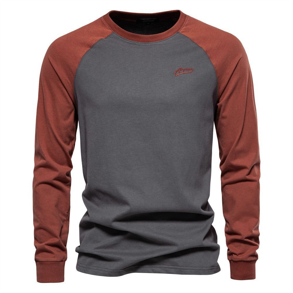 Charcoal grey raglan long sleeve top with rust-coloured contrast sleeves
