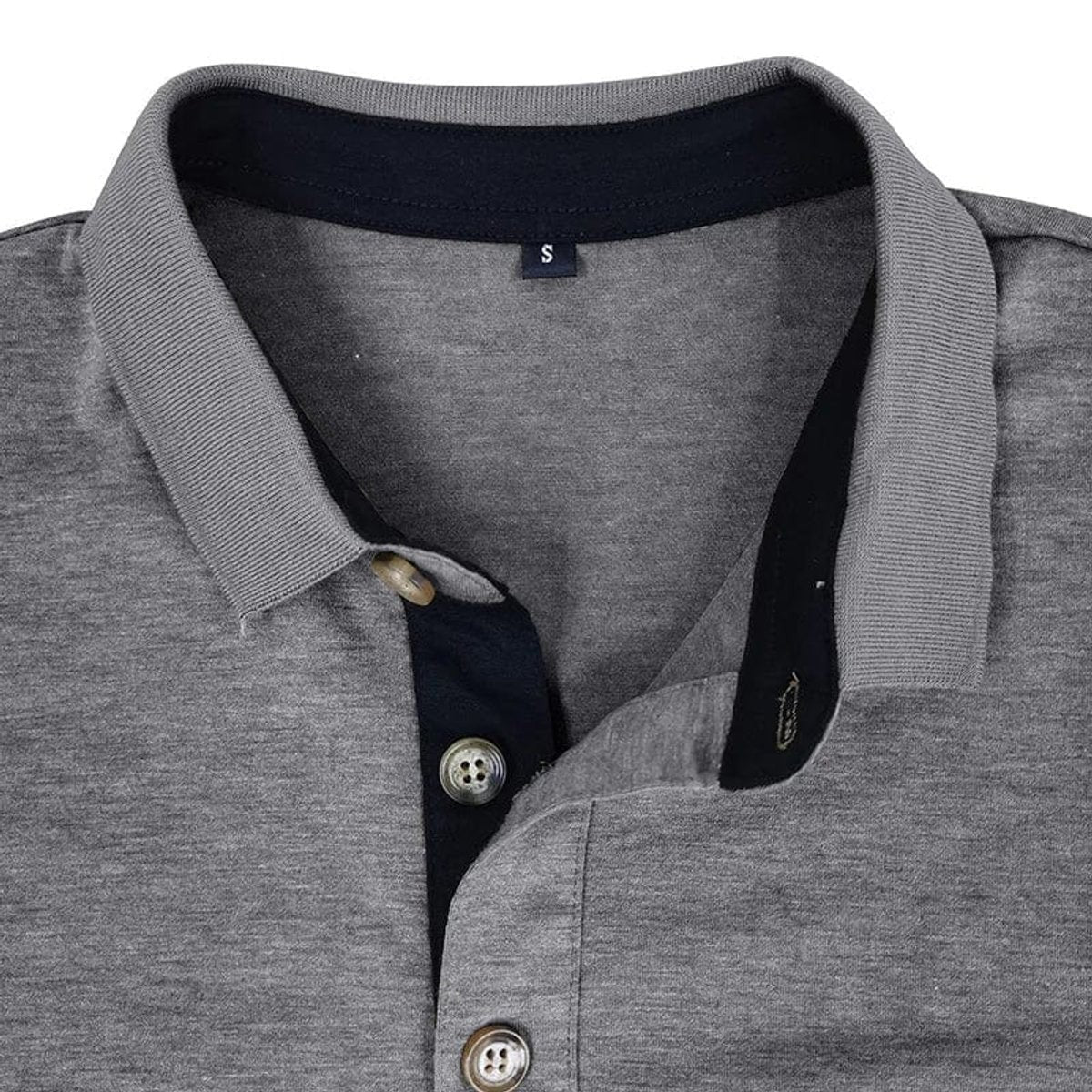 Close-up of grey polo shirt collar showing contrast placket and buttons