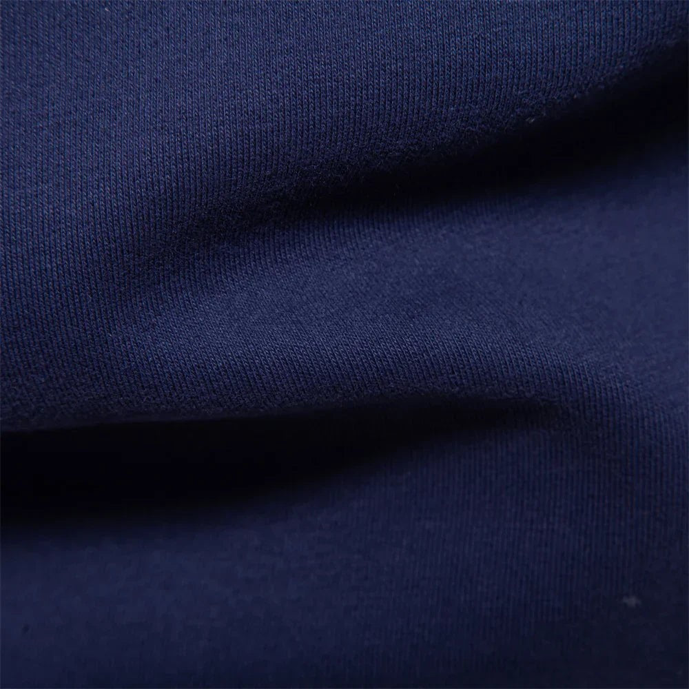 Close-up of soft navy cotton-blend sweatshirt fabric texture