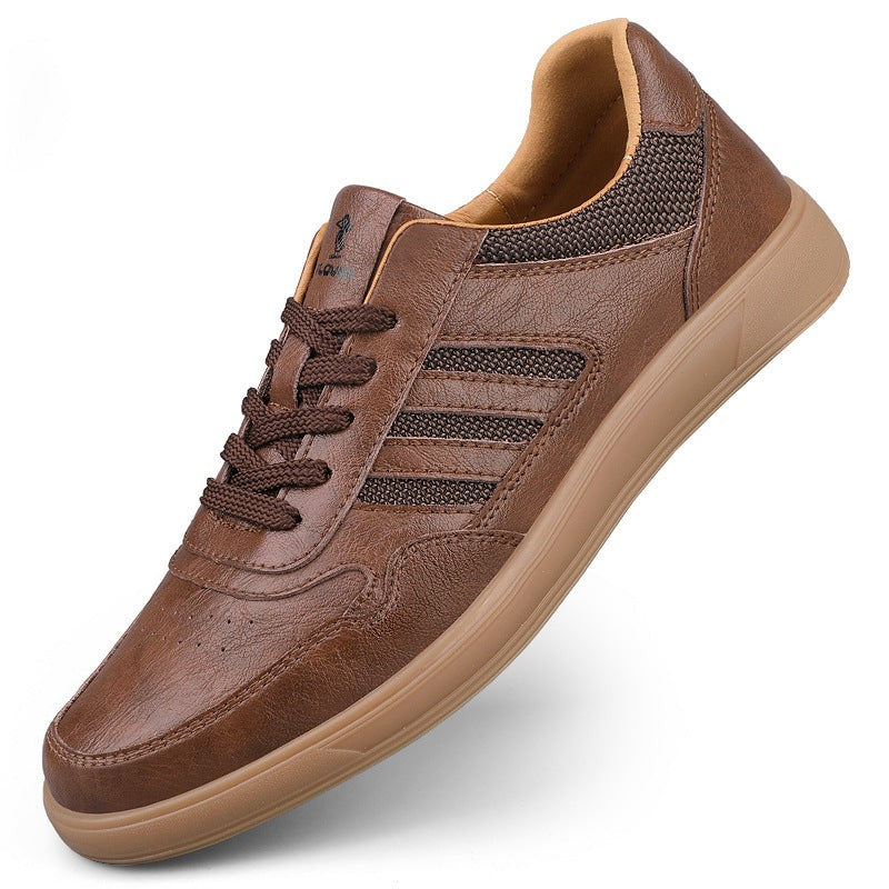 Brown leather trainer with ribbed side panels and gum sole