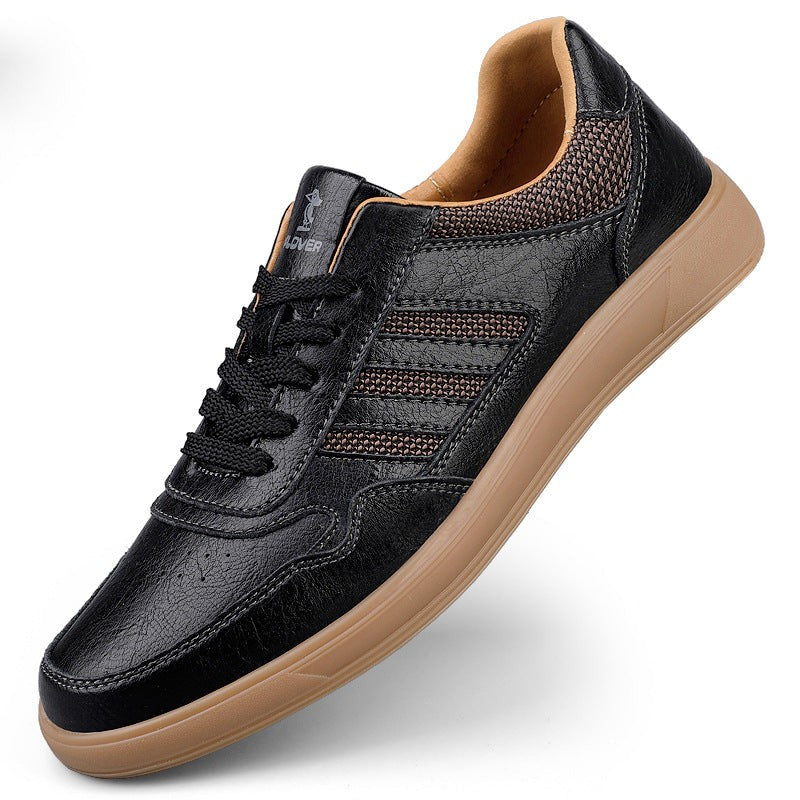 Black leather trainer with textured side stripes and gum sole