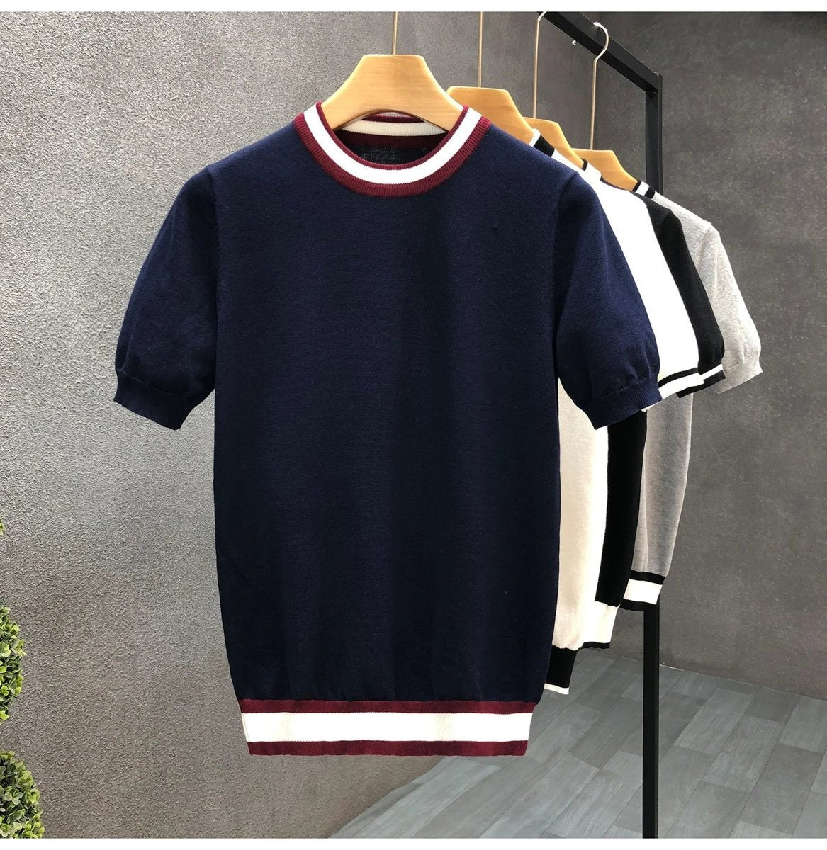 Navy knitted crewneck jumper with contrast burgundy and white striped trim