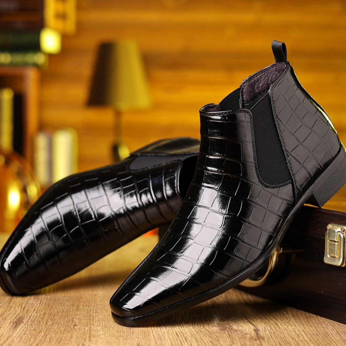 Black croc-embossed leather Chelsea boots with pointed toe and slip-on design