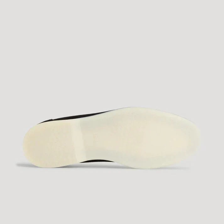 Underside view of loafer showing cream rubber sole