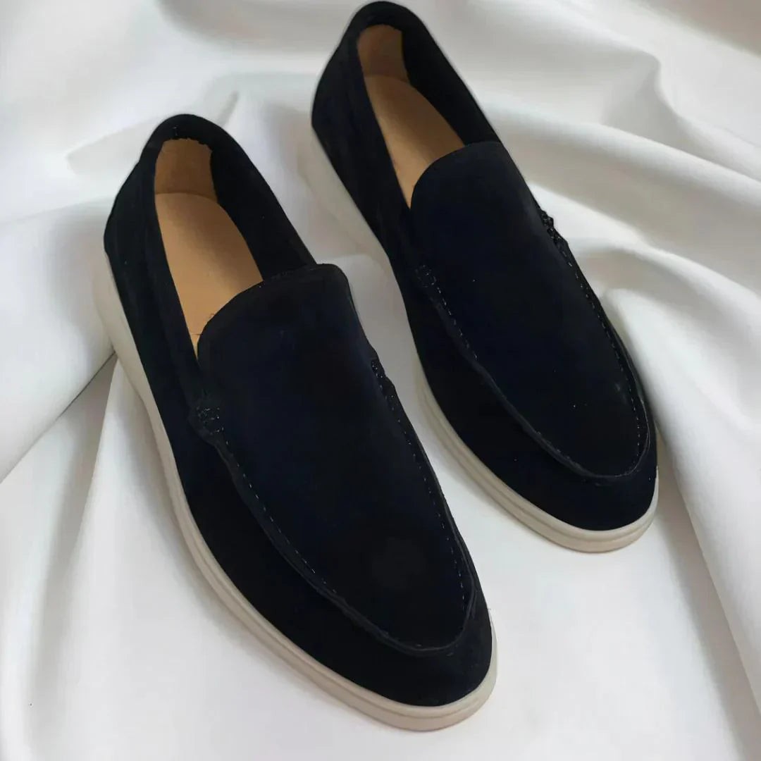 Pair of black suede loafers with contrast white soles