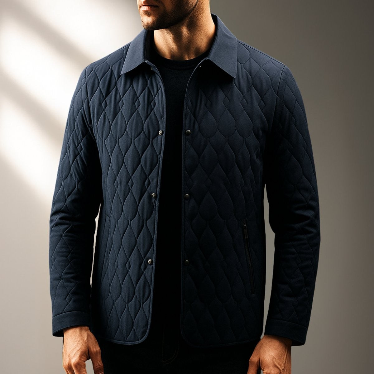 Man modelling navy quilted lightweight jacket with classic collar