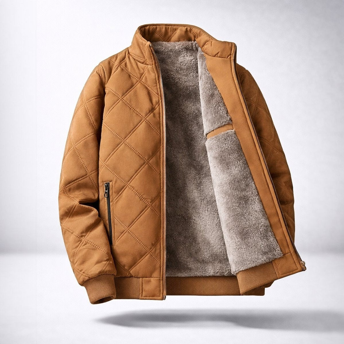 Tan diamond-quilted bomber jacket with plush fleece lining and zip pocket