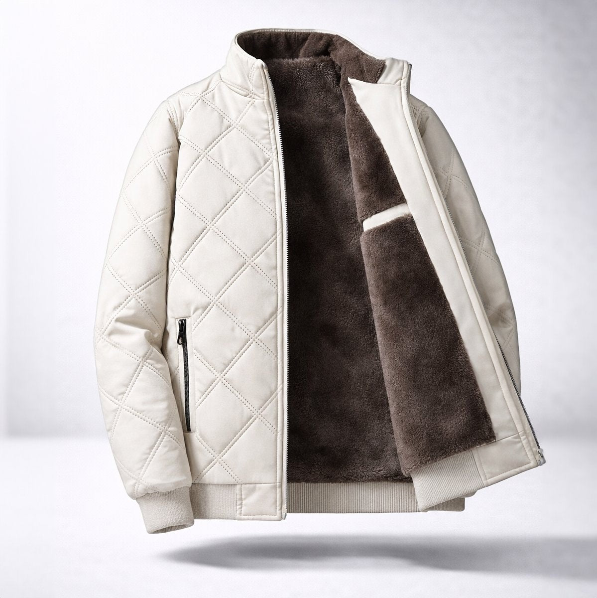 Off-white quilted bomber jacket showing brown fleece lining and stand collar