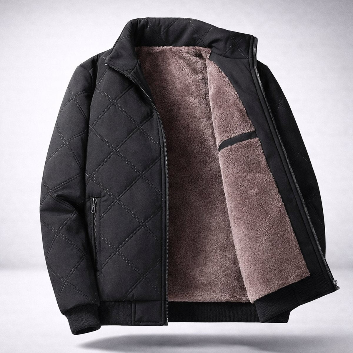 Black diamond-quilted bomber jacket open to show soft fleece lining