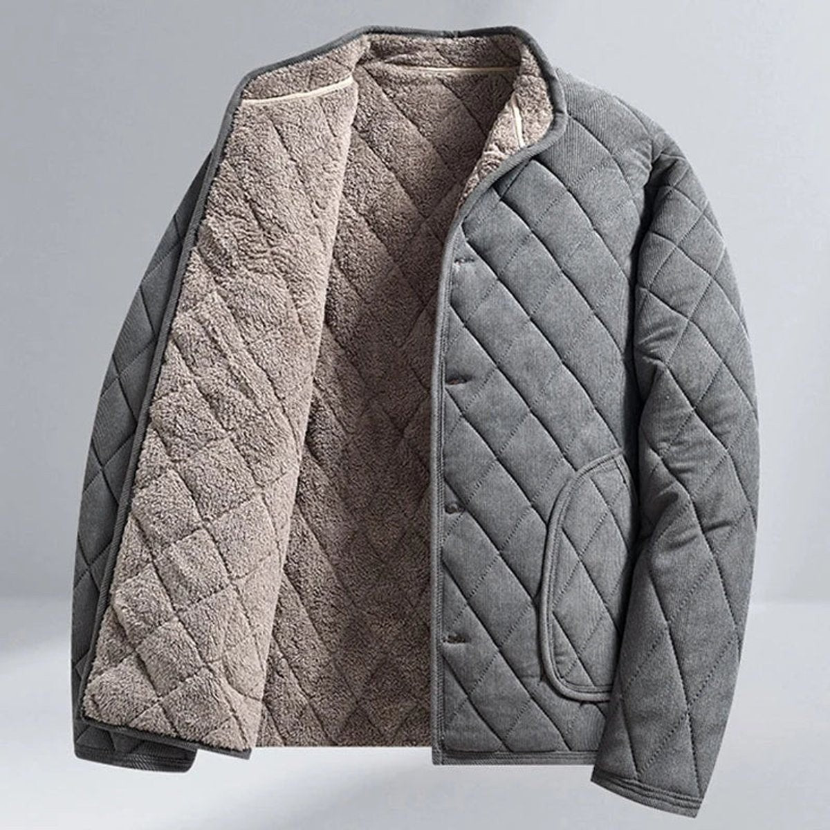 Open grey quilted jacket showing soft fleece lining and press-stud fastening