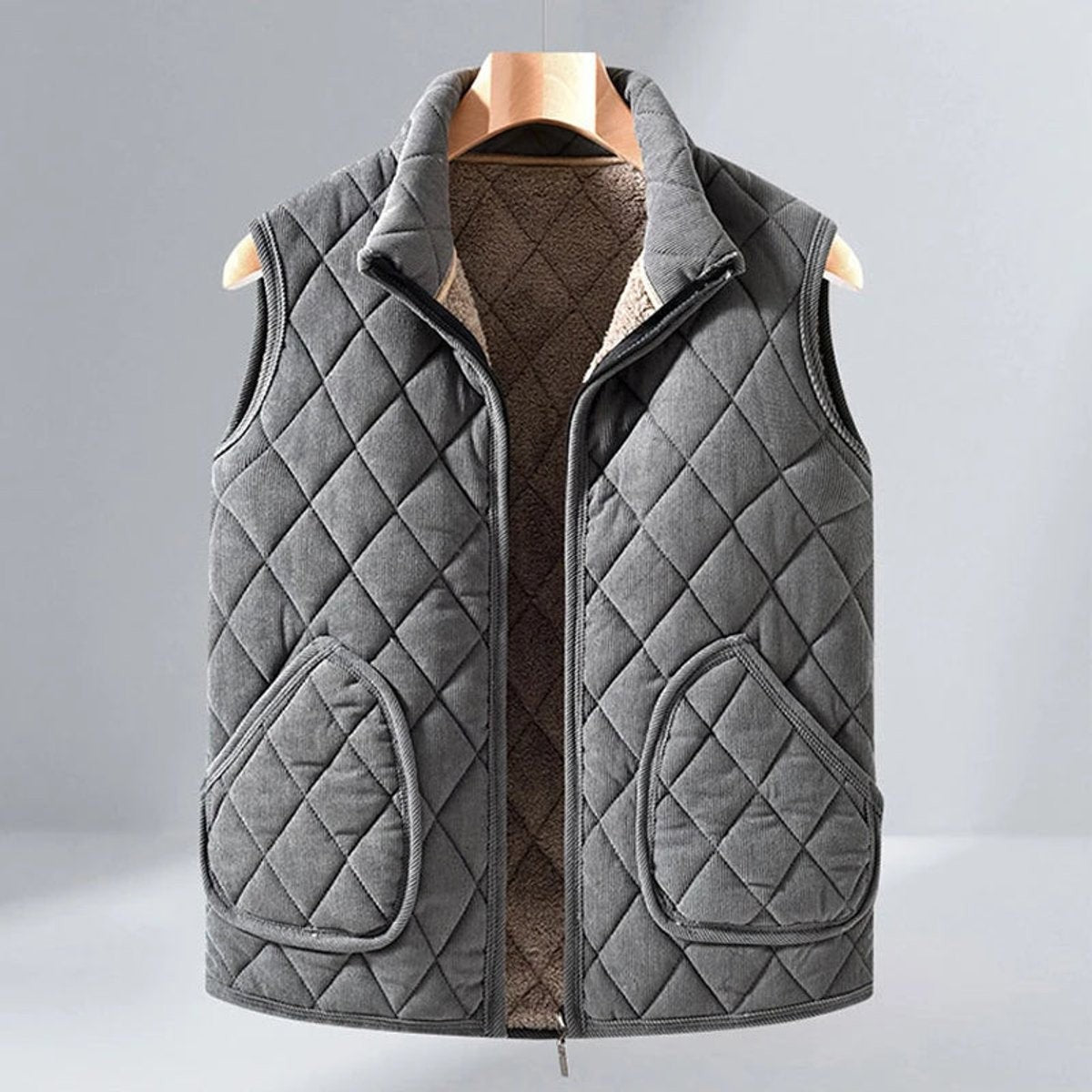 Sleeveless grey quilted gilet with fleece lining and twin front pockets