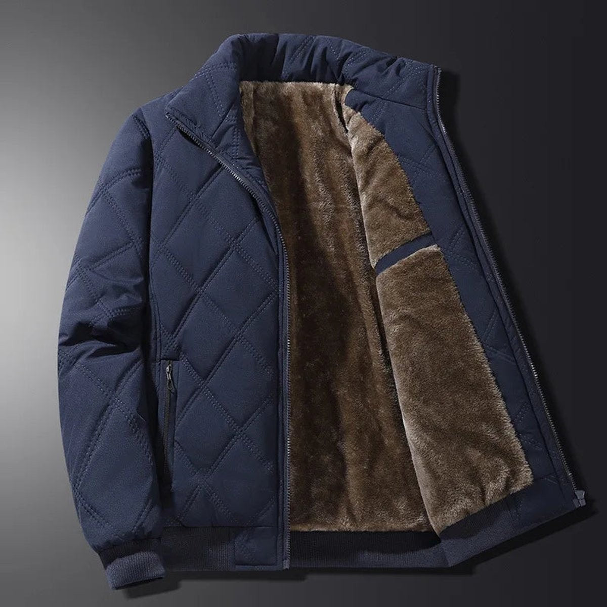 Navy quilted bomber jacket displaying thick fleece lining and zip front
