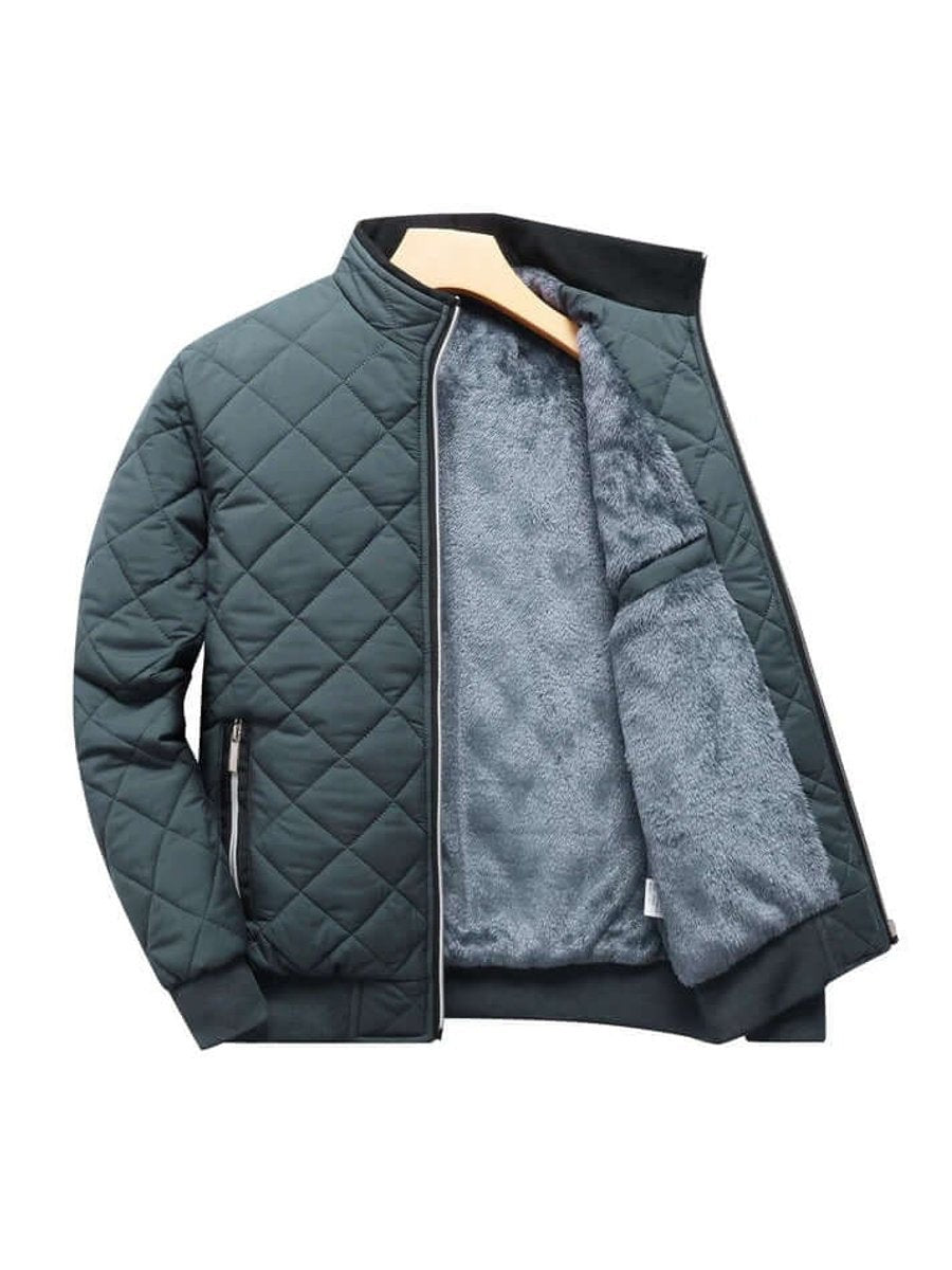 Dark teal quilted bomber jacket open showing soft grey fleece interior
