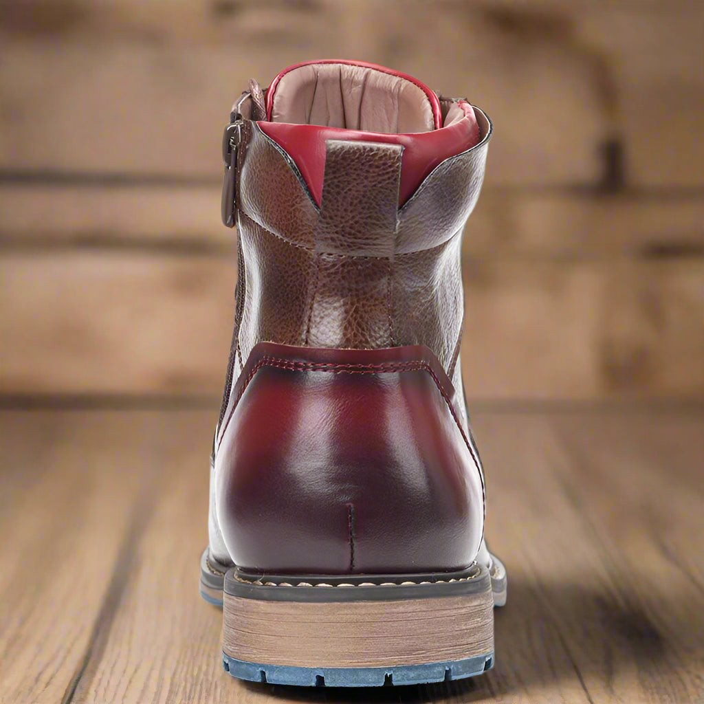 Rear view of ankle boot highlighting burgundy heel counter and zip pull