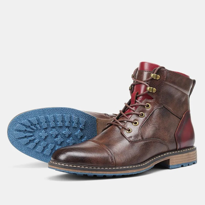 Brown leather Chelsea-style lace boots paired flat with contrasting blue outsole