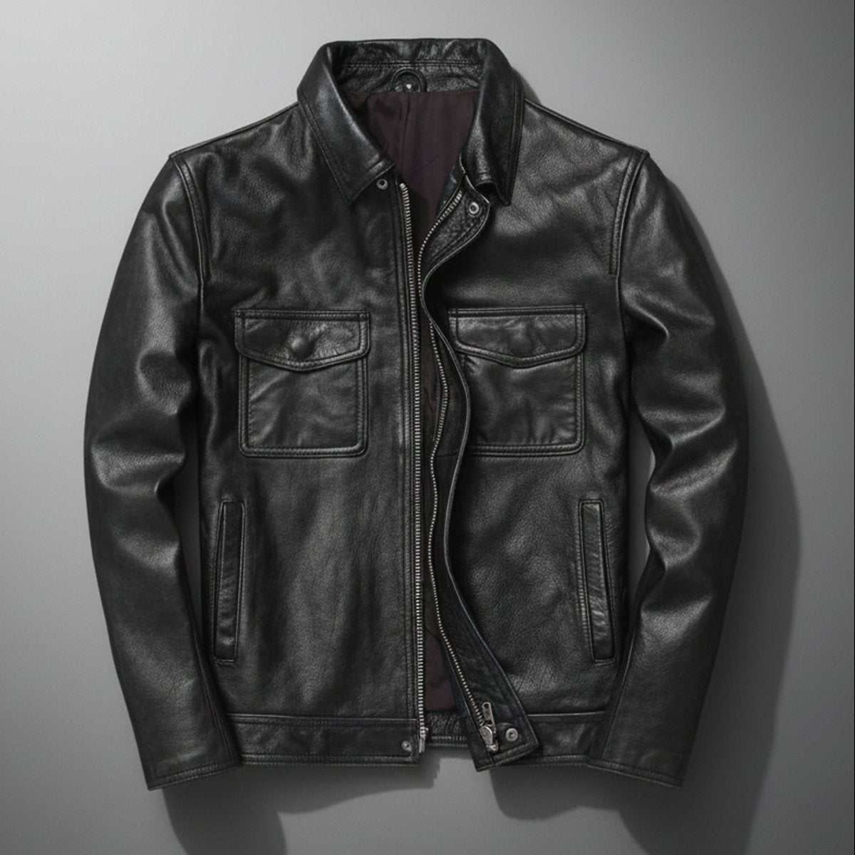 Black leather field jacket with flap pockets and silver zip closure