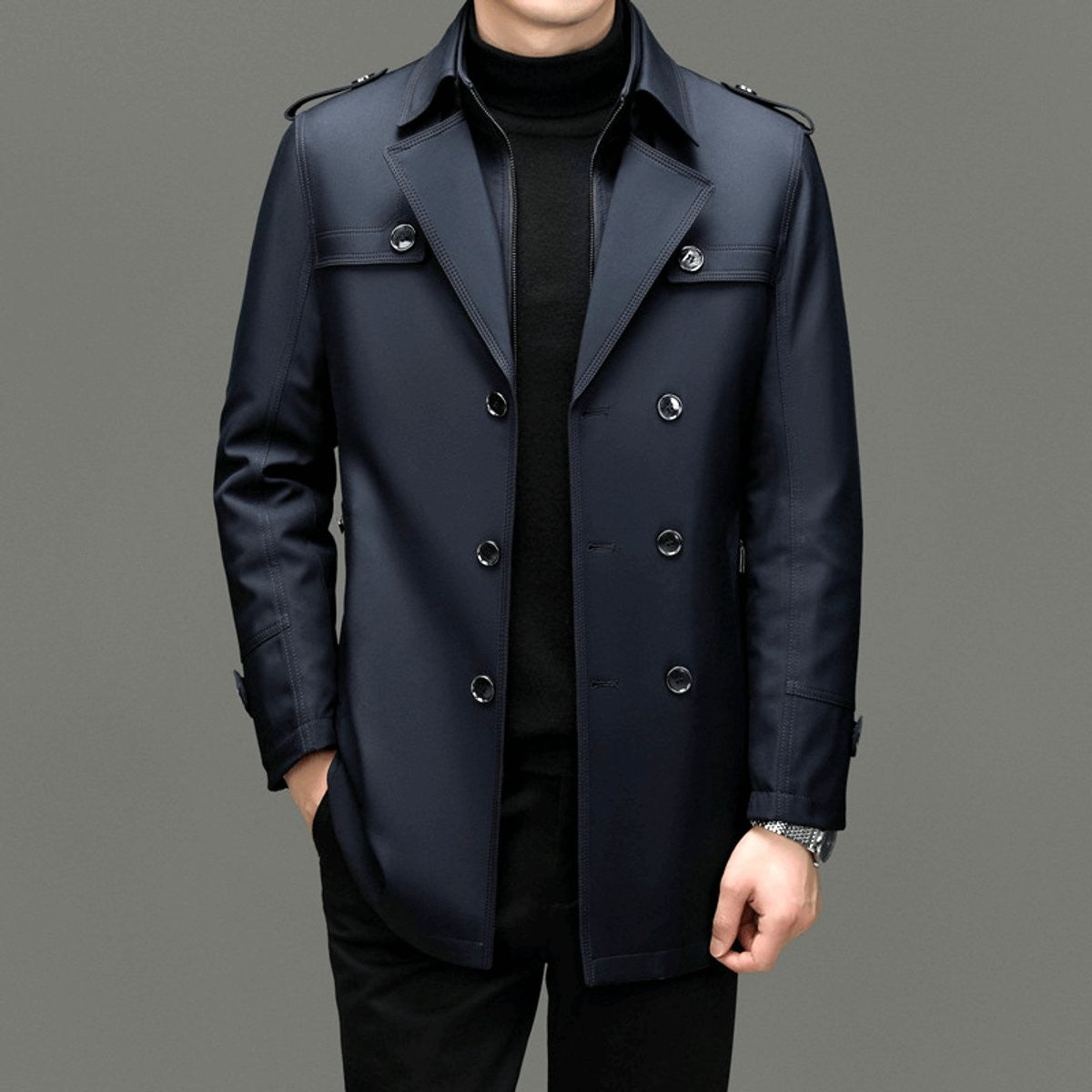 Navy double-breasted trench coat styled with black polo neck jumper