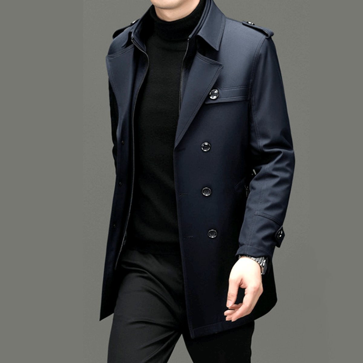 Side view of navy trench coat highlighting epaulette shoulder detailing