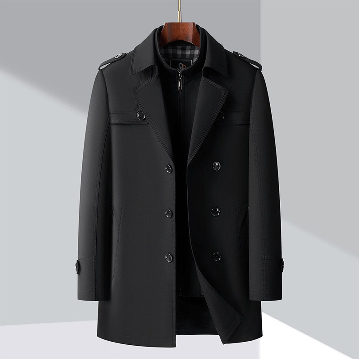 Man modelling black trench coat with epaulettes and notched lapel