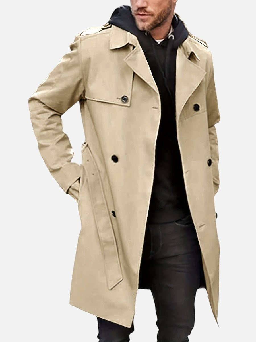 Beige trench coat worn with belt, styled with black hoodie and jeans