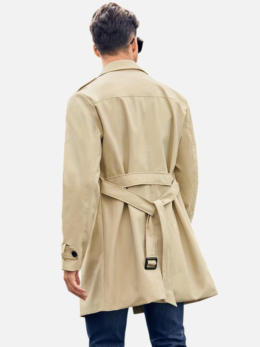 Back view of beige belted trench coat showing tie waist detail