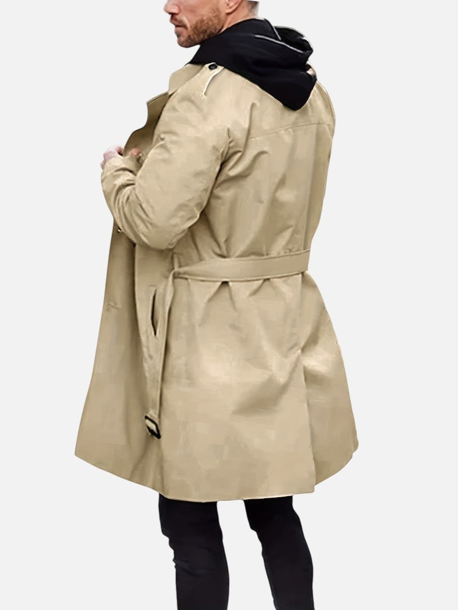 Man in beige trench coat with hood underneath, back view