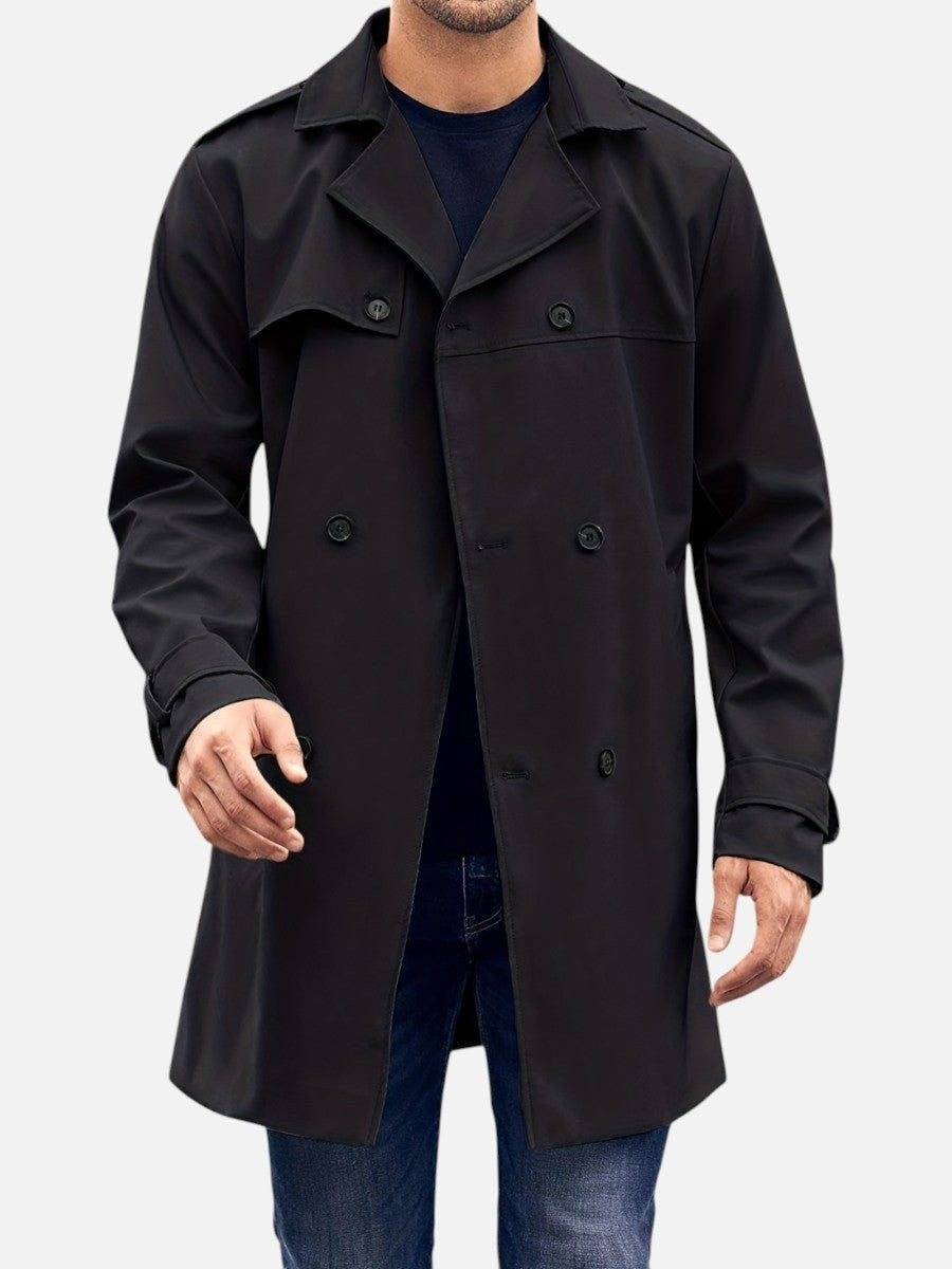 Man wearing black tailored trench coat with button fastening, front view