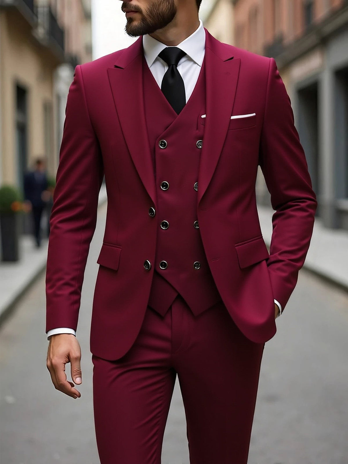 Burgundy three-piece suit with double-breasted waistcoat and peak lapel blazer