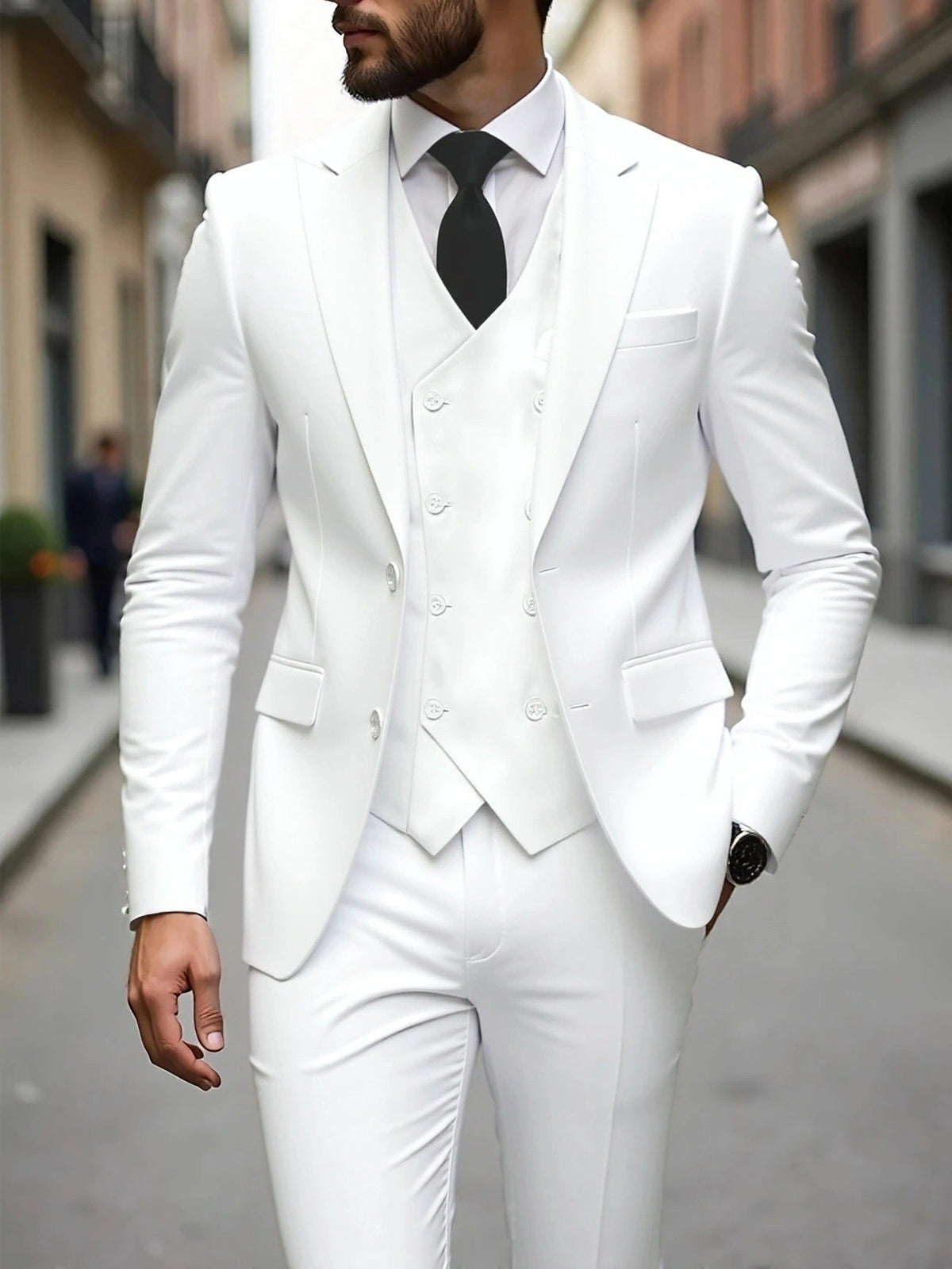 White three-piece suit with double-breasted waistcoat and black tie contrast