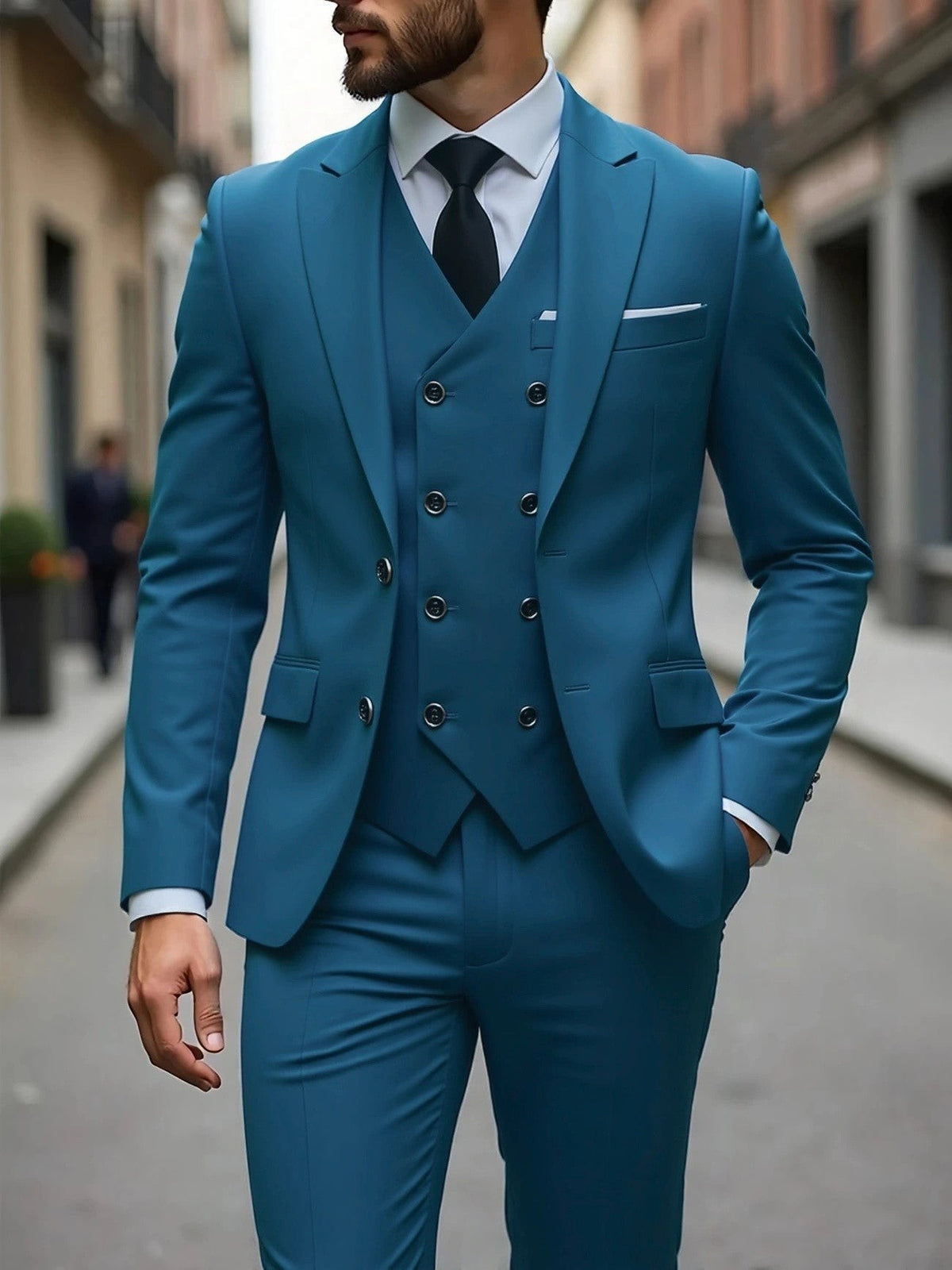 Teal three-piece suit with double-breasted waistcoat and peak lapel jacket