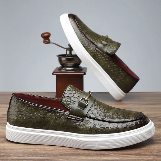 Khaki green leather loafers with embossed texture and gold snaffle hardware