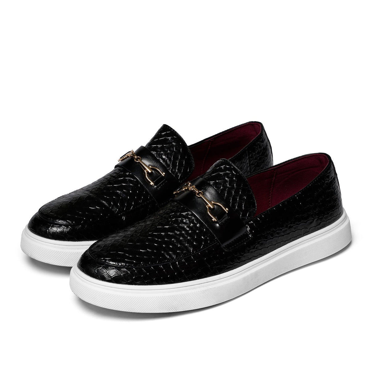 Black textured leather loafers paired together with white platform soles