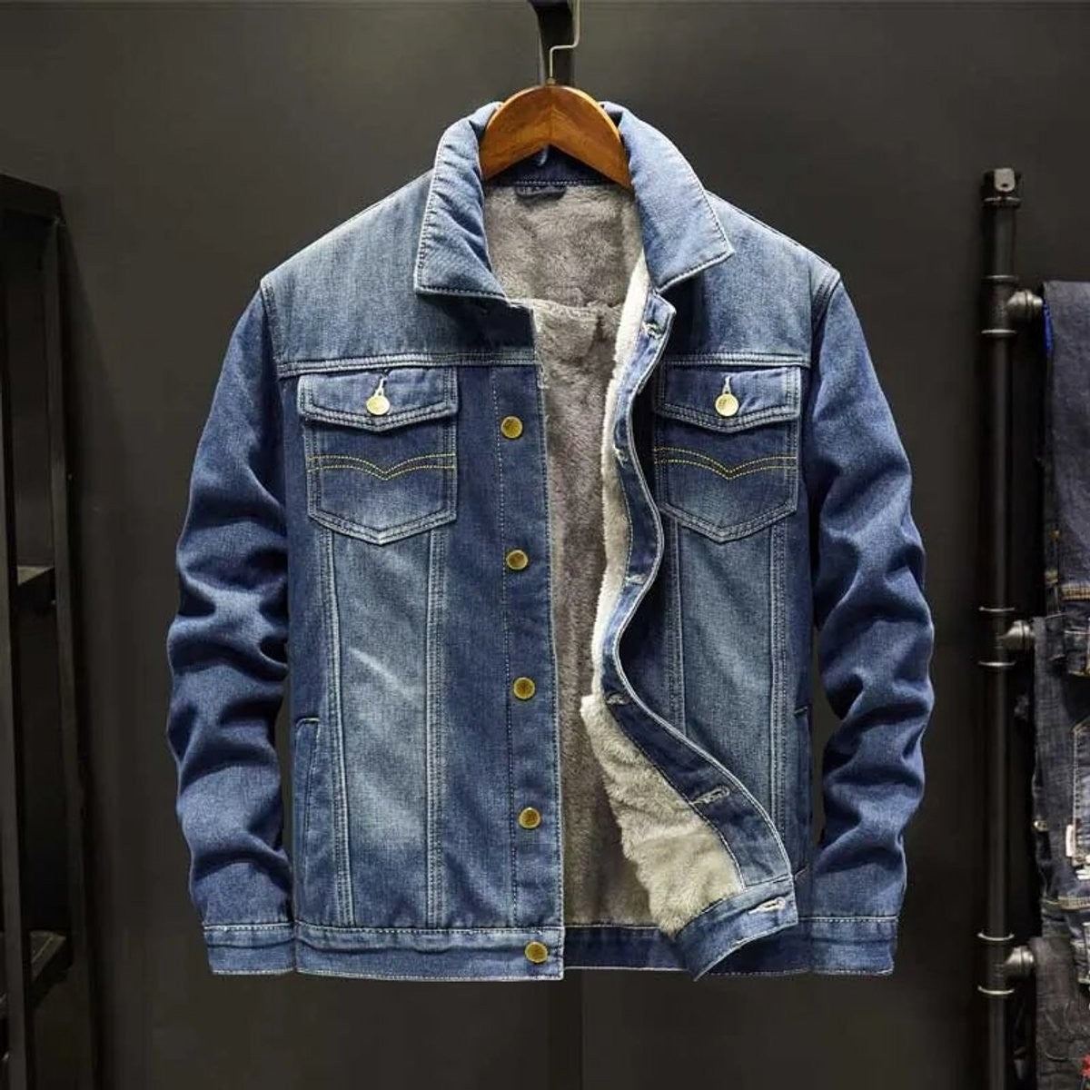 Blue denim jacket featuring fleece lining and classic collared trucker style