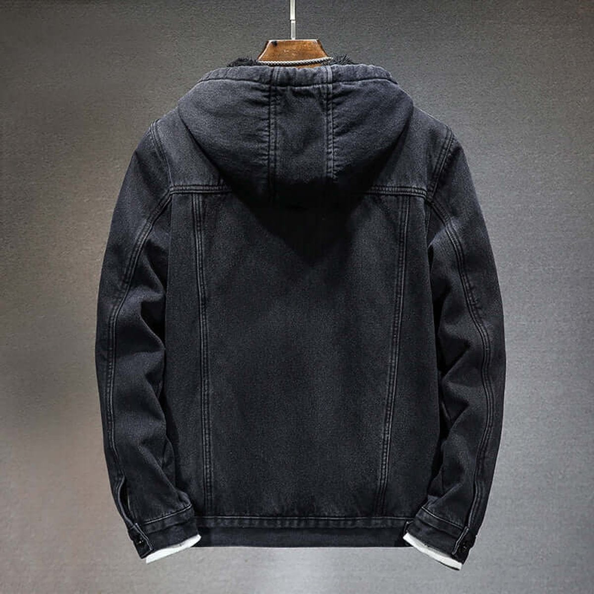 Rear view of black denim hooded jacket showing fleece trim collar