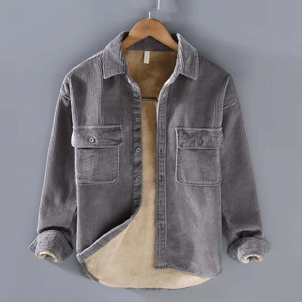 Grey corduroy shirt jacket featuring fleece lining and button cuffs